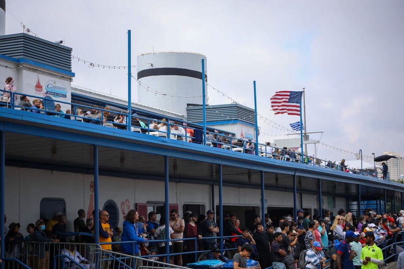 Throng of people stand at North Avenue Beach building