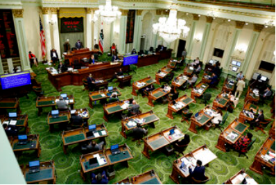 FILE - In this May 26, 2020, file photo, members of the state Assembly meet at the Capitol in Sacramento, Calif. Lawmakers will return to the Capitol, Monday, Jan. 3 for the final year of their two-year legislative session.