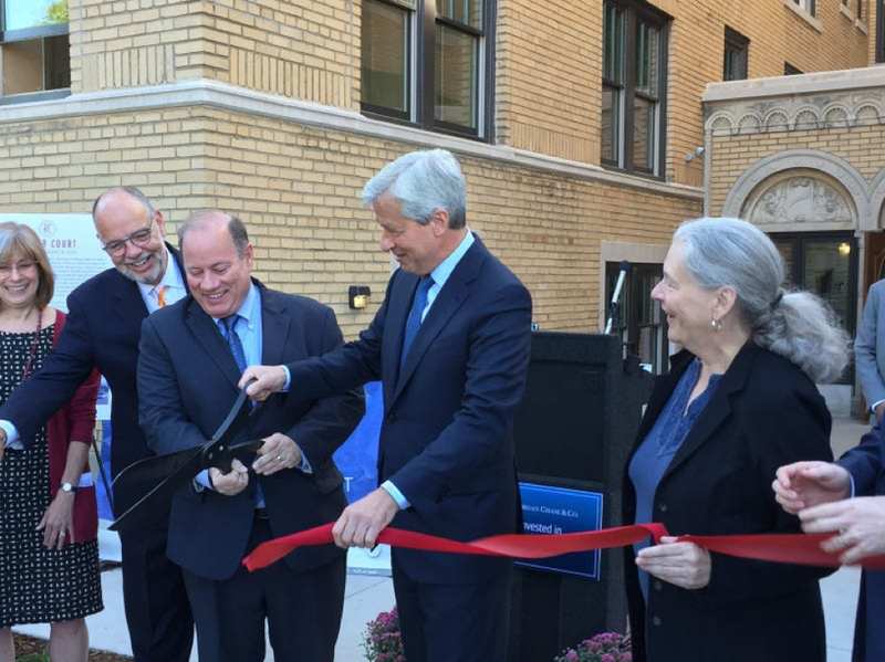 Mayor Mike Duggan is joined by JPMorgan Chase CEO Jamie Dimon (center) and Midtown Detroit Inc.'s Sue Mosey (right) at the September 17, 2015 ribbon-cutting at the Rainer Court apartments project in Midtown Detroit.
