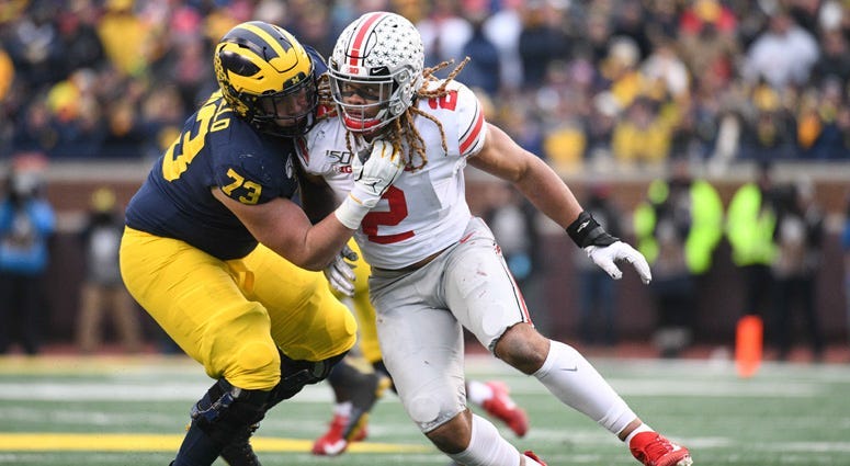 Ohio State defensive end Chase Young looks to get around Michigan offensive lineman Jalen Mayfield on Nov. 30, 2019 in Ann Arbor, Michigan.