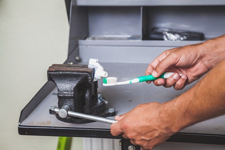 Squeezing toothpaste with vise