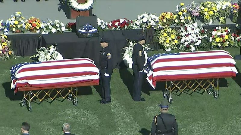 Coffins carrying Bristol Police Lt. Dustin DeMonte and Sgt. Alex Hamzy, at their funeral in East Hartford, 10/21/22