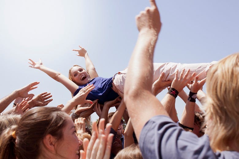 crowd surfing at concert 