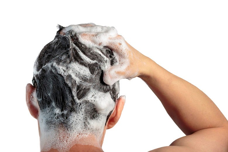 Man shampooing hair 