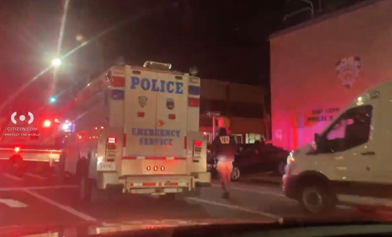 A man in his 70s displayed a weapon near an NYPD precinct house on Tuesday night.