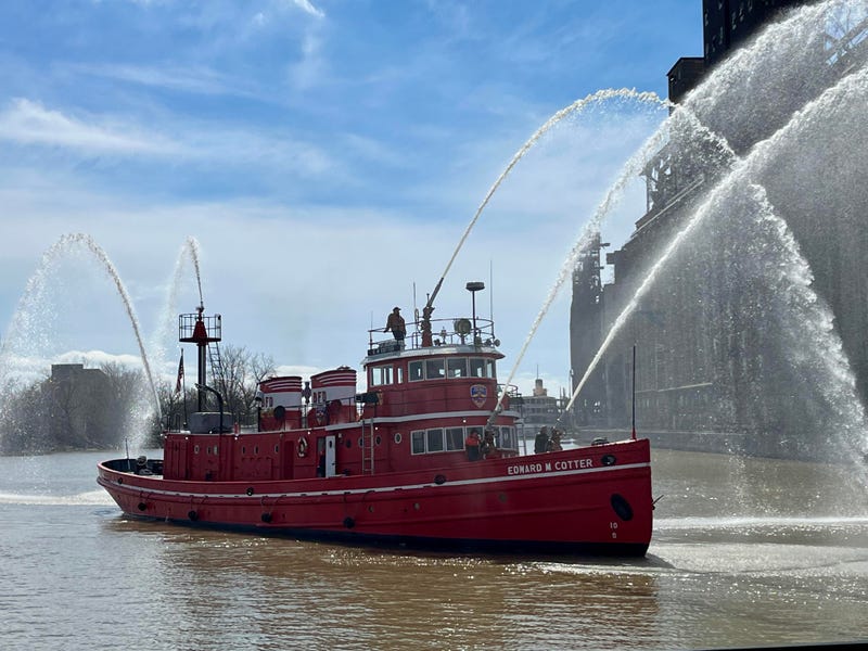 Fireboat Edward M. Cotter shooting jets of water from its fire hoses