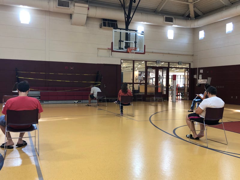 Socially distanced patients await test results at the CVS rapid test site at the Arroyo Center in Hartford.