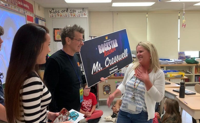 Rockstar Teacher winner Ms. Cresswell with Rocky & Lissa