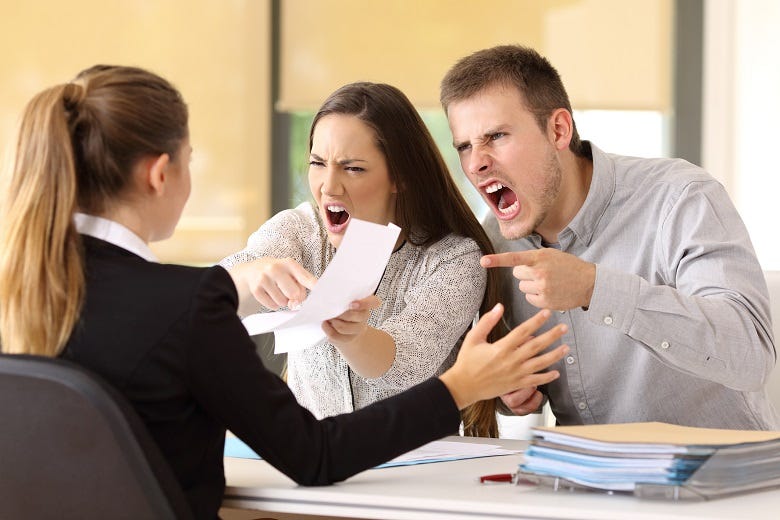 customers arguing with customer service agent 