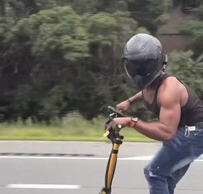 Suffolk County officials are looking to identify the man on a scooter who punched a woman in the face in front of her two kids earlier this week.