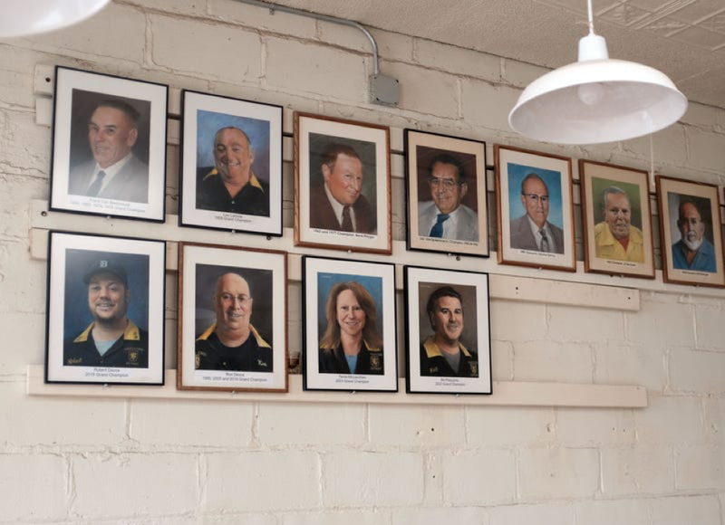 Portraits of feather bowling Grand Champions hang on the wall at the Cadieux Cafe in Detroit