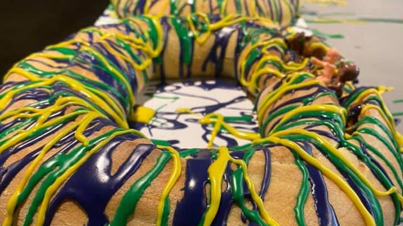 king cakes lined up in a bakery