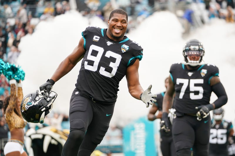 DE Calais Campbell runs out of the tunnel at a Jaguars home game.