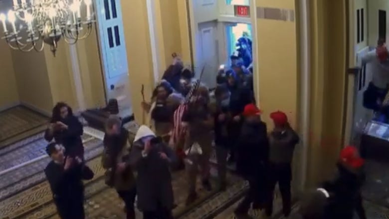 WATCH: Never-before-seen security footage of Capitol riot played at Trump's impeachment trial
