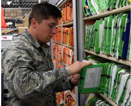 Airman Logan Schmidt, 341st Medical Support Squadron health administration specialist, retrieves a patient’s medical records from the outpatient records office long-term storage at Malmstrom Air Force Base, Mont. April 12, 2016.