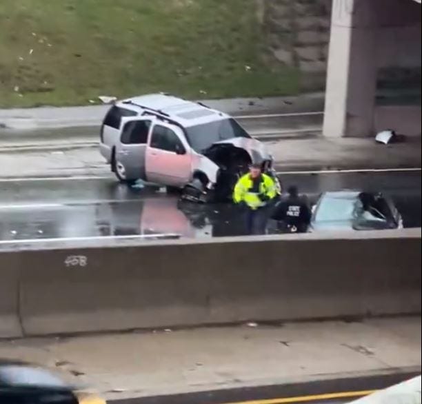 First responders investigate damaged car