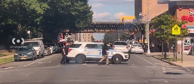 Police car waiting near Brownsville Academy High School in Brooklyn.