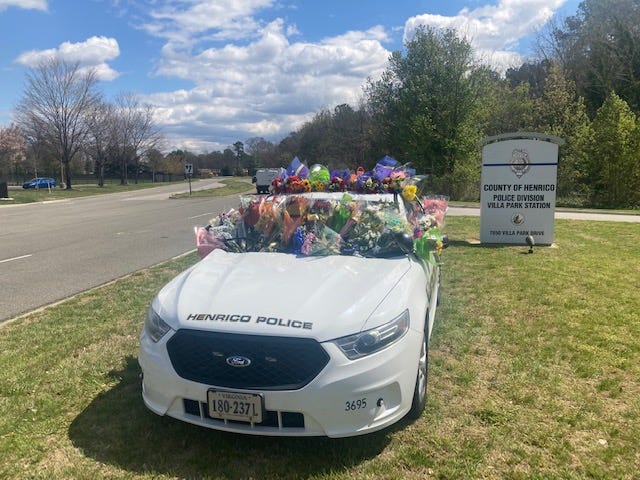 Henrico Police Car with flowers in memory of Officer Trey Sutton