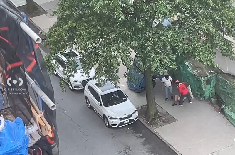 A man was helped from the driver's seat of a car that fell over the edge of an elevated parking lot in the Bronx  on Friday.