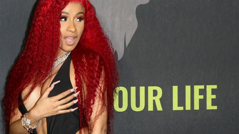 Watch Cardi B Take on Slap Bracelets, a Fax Machine, and '90s Slang