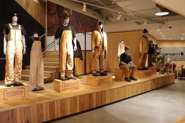 Showroom display of Carhartt coats, coveralls, hats, etc. 