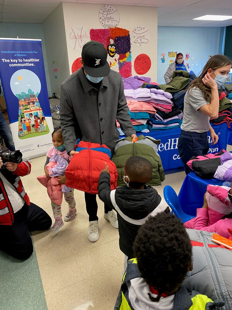 Dylan Carlson hands out coats