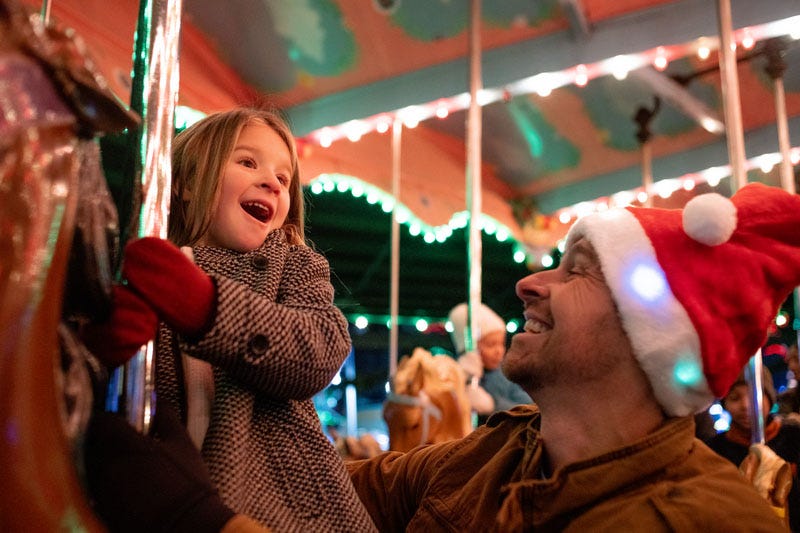 Girl riding a carousel at Kennywood