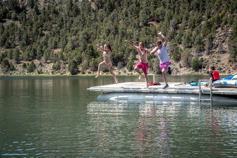 Kids jump off of a pier at Cave Lake State Park.