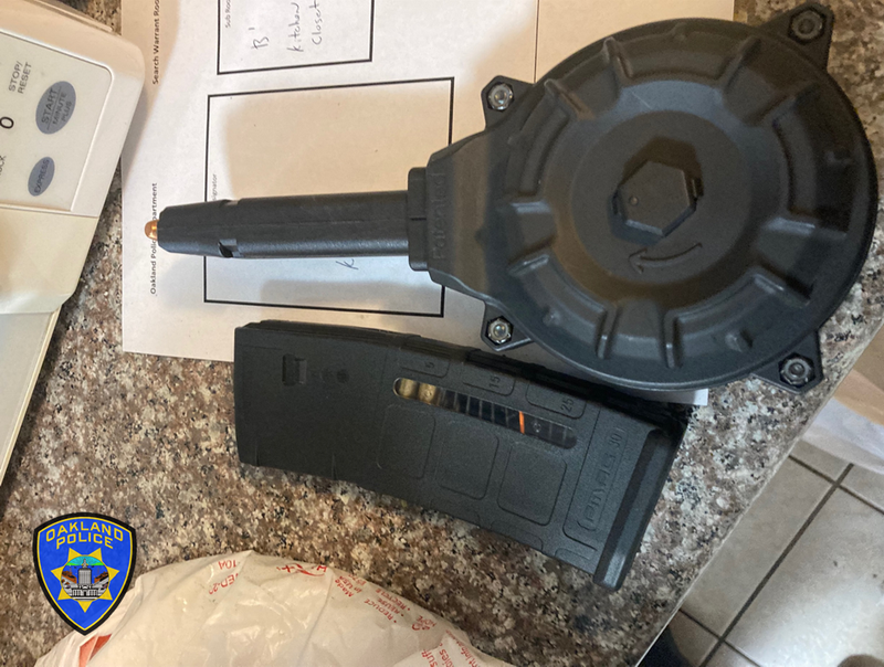 Officers recovered five firearms with high-capacity magazines during the investigation on Wednesday.