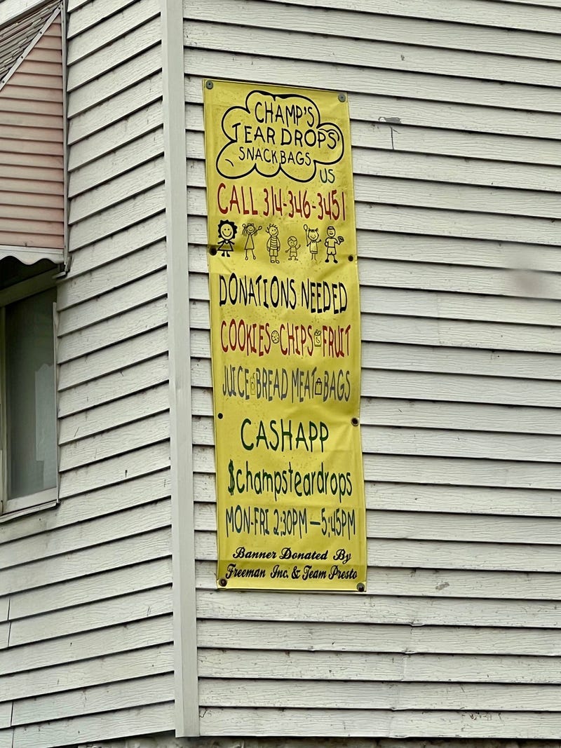 A banner on the side of her home helps families in need, and donors find Champ's Tear Drops