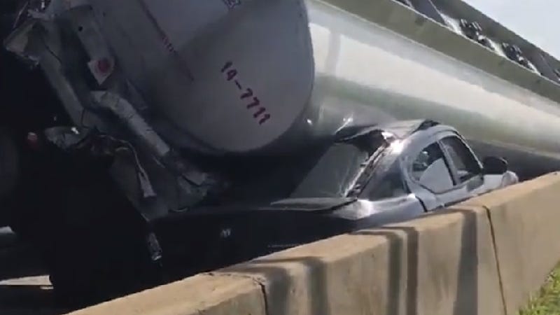 One killed after gravel hauler strikes pick-up, semi truck, knocking trailer onto car on I-75 in Detroit