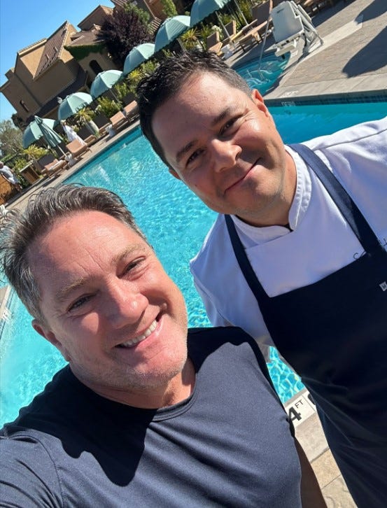 Liam Mayclem with Executive Chef Sergio Howland.