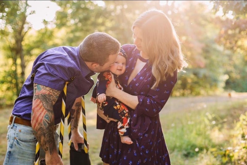 Brandon Rumbaugh, his wife Cassy, and their daughter Remi