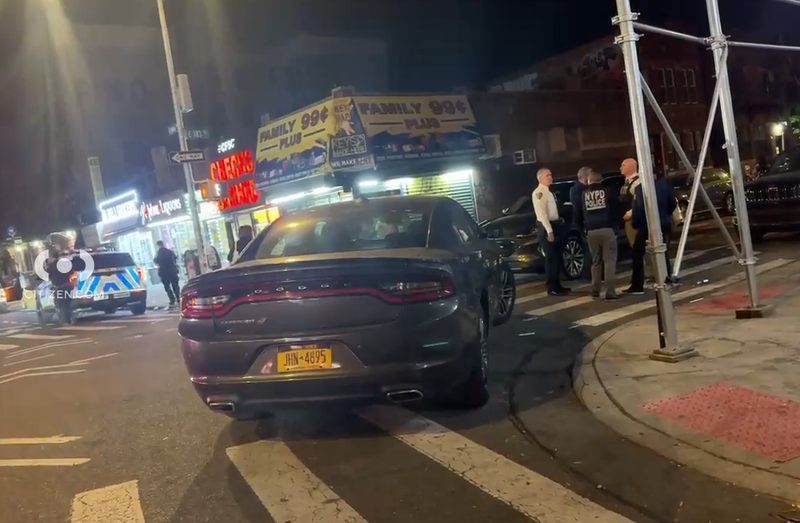 Police investigate at the scene of the shooting in the Belmont section of the Bronx