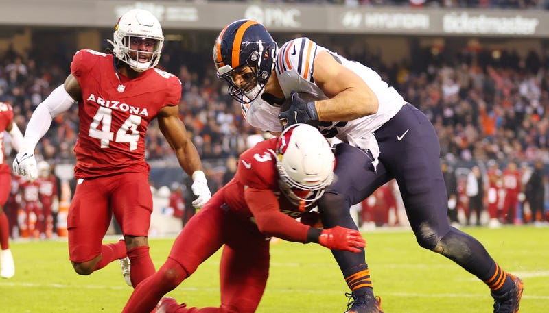 Bears tight end Cole Kmet, right, makes a reception against the Cardinals.