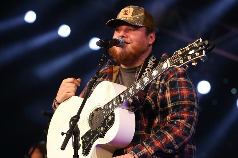  Luke Combs performs during a Radio.com 'Stars and Strings' Concert to honor our nation's veterans at Chicago Theatre on November 7, 2018