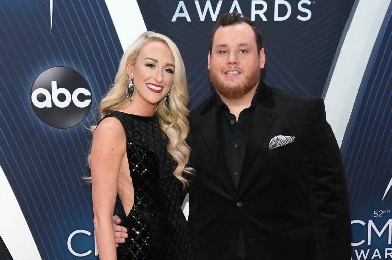 Nicole Hocking and singer-songwriter Luke Combs attend the 52nd annual CMA Awards at the Bridgestone Arena on November 14, 2018