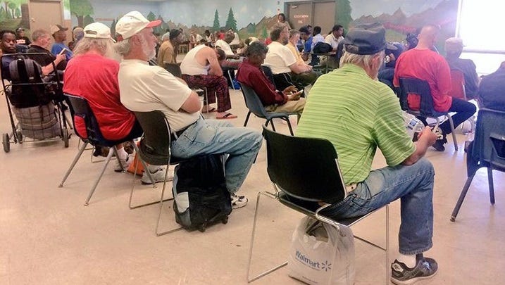 People get out of the heat at a Clark County cooling station location.