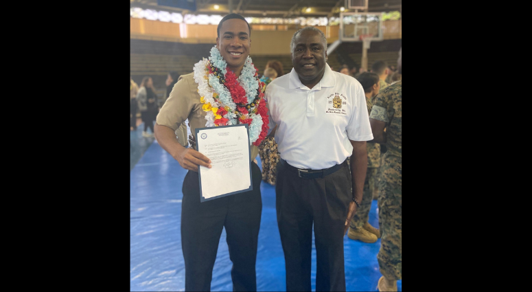 Newly promoted Yeoman 1st Class Reginald Theophilus Parker stands beside his personal and professional mentor, Alphonso Braggs, in November 2023