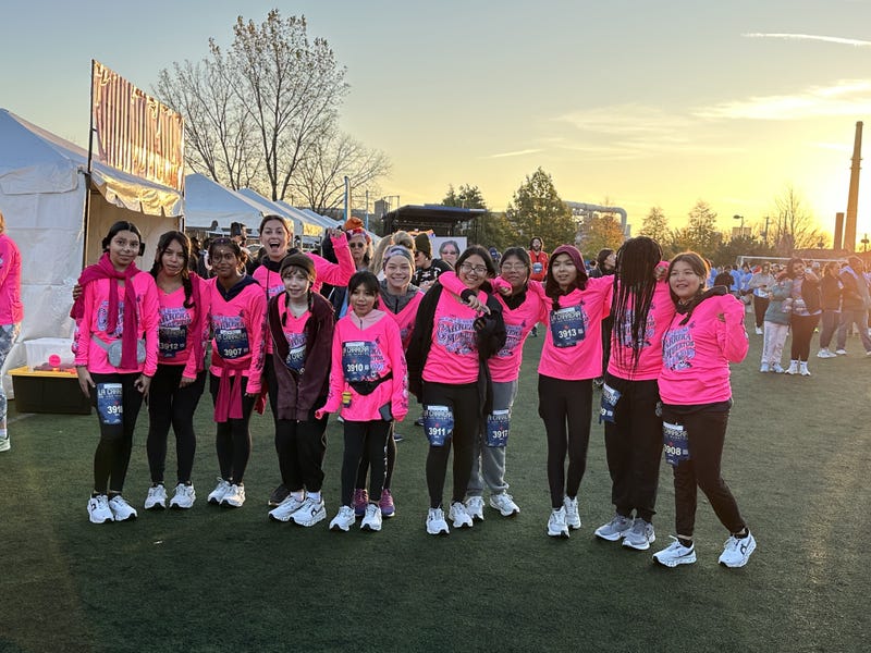 Participants of Carrera de los Muertos 2024 pose for a photo. This year's race takes place Nov. 1 at Benito Juarez Community Academy in Pilsen.