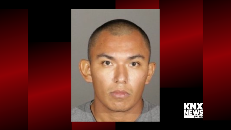 mugshot of young latino man with shaved head