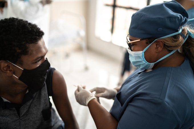 A man receives his coronavirus vaccination