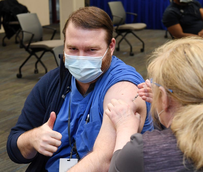 A man receives his coronavirus vaccination