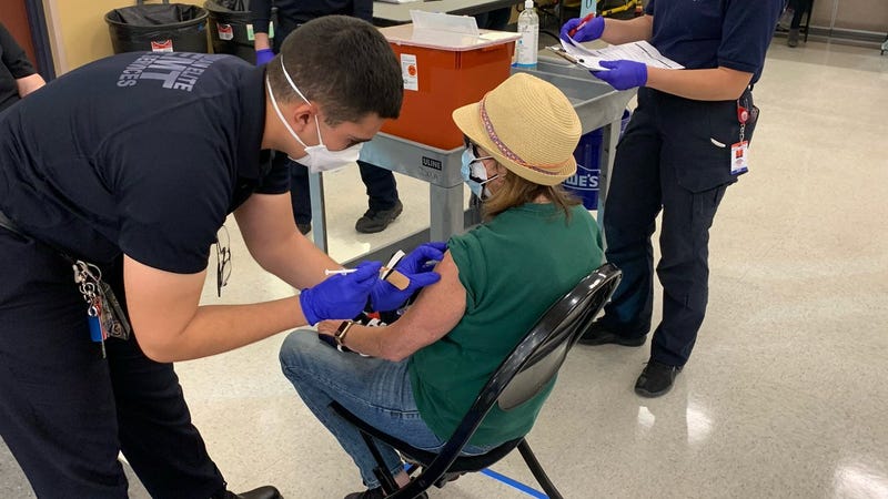 A person receives their coronavirus vaccination