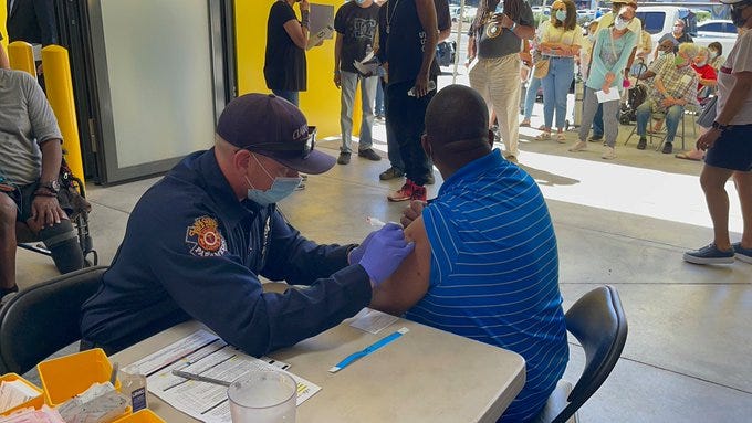 A man receives his coronavirus vaccination
