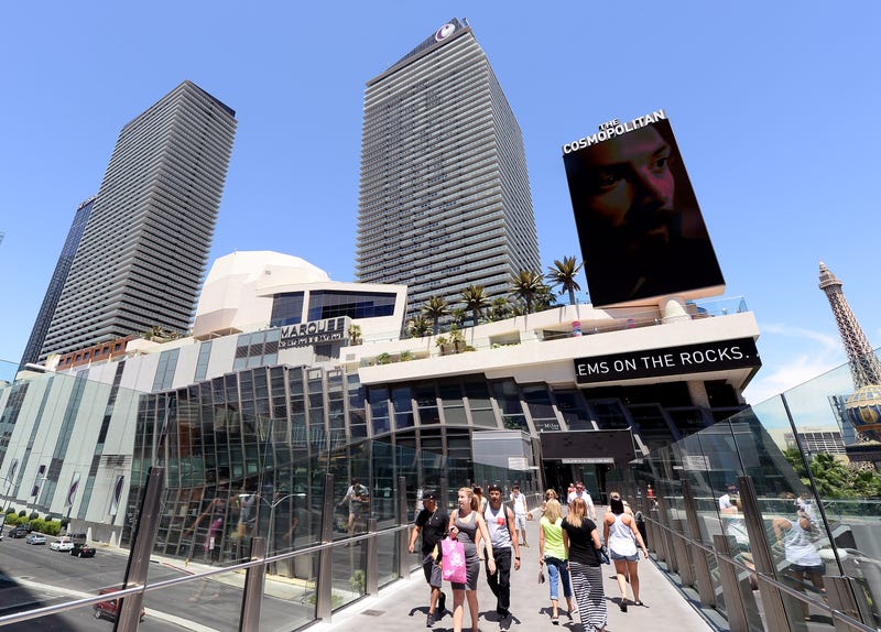 Pedestrians use a bridge to cross to and from the Cosmopolitan Hotel