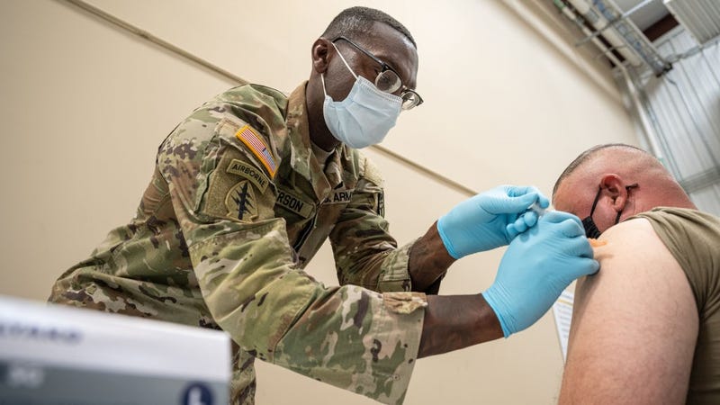 Preventative Medicine Services NCOIC Sergeant First Class Demetrius Roberson administers a COVID-19 vaccine to a soldier on September 9, 2021 in Fort Knox, Kentucky.
