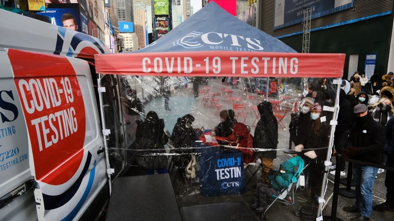  People wait in line to get tested for COVID-19 at a testing facility in Times Square on December 09, 2021 in New York City.