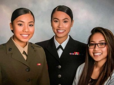Ohu (left) in a family portrait with her older sister Pan Phyu (center) and younger sister Kay Yu (right).