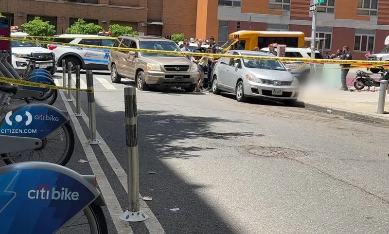 Police cordoned off the crash scene, with the victims body on the sidewalk nearby